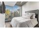 Well-lit bedroom features a large window with outside views and modern decor at 3300 Windy Ridge Se Pkwy # 718, Atlanta, GA 30339