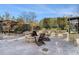 Outdoor fire pit area with Adirondack chairs and stone benches, perfect for socializing at 3300 Windy Ridge Se Pkwy # 718, Atlanta, GA 30339