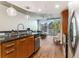 Contemporary kitchen flows into a living space with floor-to-ceiling windows at 3300 Windy Ridge Se Pkwy # 718, Atlanta, GA 30339