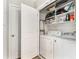 Bright laundry room with washer, dryer, and ample shelving at 3300 Windy Ridge Se Pkwy # 718, Atlanta, GA 30339