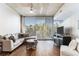 Living room with large windows and comfortable seating arrangement at 3300 Windy Ridge Se Pkwy # 718, Atlanta, GA 30339