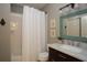 Clean bathroom with a shower and tub, vanity, and framed mirror at 3510 Woodbury Creek Dr, Cumming, GA 30041