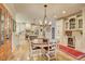 Dining Room featuring a wooden table, hardwood floors, and view to the kitchen at 3510 Woodbury Creek Dr, Cumming, GA 30041