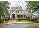 Beautiful two story house with a sprawling front porch and manicured landscaping at 3510 Woodbury Creek Dr, Cumming, GA 30041