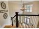 Elegant foyer with hardwood floors, staircase, chandelier, and detailed trim at 3510 Woodbury Creek Dr, Cumming, GA 30041