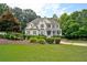 Charming two-story home with lush landscaping, mature trees, and great curb appeal at 3510 Woodbury Creek Dr, Cumming, GA 30041