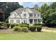 Charming two-story home with lush landscaping, mature trees, and great curb appeal at 3510 Woodbury Creek Dr, Cumming, GA 30041