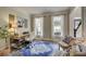 Bright home office with a large window, desk, chair, and stylish decor at 3510 Woodbury Creek Dr, Cumming, GA 30041