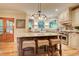 Gourmet kitchen featuring a long island with seating and stainless steel appliances at 3510 Woodbury Creek Dr, Cumming, GA 30041