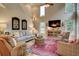 Inviting living room with high ceilings, large windows, fireplace, and comfortable seating at 3510 Woodbury Creek Dr, Cumming, GA 30041