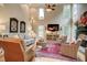 Bright living room with tall ceilings, hardwood floors, fireplace, and lots of natural light at 3510 Woodbury Creek Dr, Cumming, GA 30041