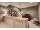 Entertainment area featuring a built-in bar, plush chair, media center and recessed lighting at 3510 Woodbury Creek Dr, Cumming, GA 30041