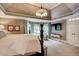 Comfortable primary bedroom with sitting area, plush carpeting, and lots of natural light at 3510 Woodbury Creek Dr, Cumming, GA 30041