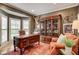 Private home office with custom built-ins and a large desk, creating an ideal workspace at 3510 Woodbury Creek Dr, Cumming, GA 30041