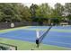 Community tennis courts, providing a recreational space for tennis enthusiasts to enjoy friendly matches at 3510 Woodbury Creek Dr, Cumming, GA 30041