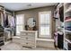 Spacious walk-in closet with custom shelving, storage drawers and natural light at 3510 Woodbury Creek Dr, Cumming, GA 30041