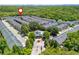 Community of townhomes surrounded by trees with a pool and skyline visible in the distance at 3799 Chattahoochee Summit Se Dr # 5, Atlanta, GA 30339