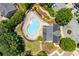 Aerial shot of a community pool with lounge chairs and landscaped gardens, providing a relaxing oasis at 3799 Chattahoochee Summit Se Dr # 5, Atlanta, GA 30339