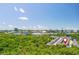 Community nestled in lush greenery with city skyline in the background under a clear blue sky at 3799 Chattahoochee Summit Se Dr # 5, Atlanta, GA 30339