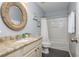 Stylish bathroom with granite countertop, wooden-framed mirror, and a bathtub with shower at 3799 Chattahoochee Summit Se Dr # 5, Atlanta, GA 30339