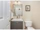 Bathroom featuring a modern vanity, decorative mirror, and a white toilet at 3799 Chattahoochee Summit Se Dr # 5, Atlanta, GA 30339
