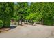 Community entrance gate to a gated community with landscaped greenery on a sunny day at 3799 Chattahoochee Summit Se Dr # 5, Atlanta, GA 30339