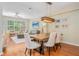 Open-concept living and dining area with hardwood floors, modern lighting, and comfortable seating at 3799 Chattahoochee Summit Se Dr # 5, Atlanta, GA 30339