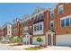 Beautiful brick townhomes with attached garages and manicured lawns, creating an inviting community atmosphere at 3799 Chattahoochee Summit Se Dr # 5, Atlanta, GA 30339