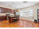 Eat-in kitchen with hardwood floors, cherry cabinets, stainless steel appliances and window seating at 3799 Chattahoochee Summit Se Dr # 5, Atlanta, GA 30339