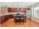 Kitchen features an island with seating, granite countertops, and stainless steel appliances at 3799 Chattahoochee Summit Se Dr # 5, Atlanta, GA 30339