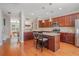 Open kitchen with an island, modern appliances, granite counters, and dining area in view at 3799 Chattahoochee Summit Se Dr # 5, Atlanta, GA 30339
