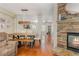 Open floor plan featuring a dining area, living room with fireplace, and hardwood floors at 3799 Chattahoochee Summit Se Dr # 5, Atlanta, GA 30339