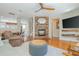 Spacious living room with hardwood floors, a fireplace, and an open layout to the dining area at 3799 Chattahoochee Summit Se Dr # 5, Atlanta, GA 30339