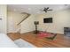 Versatile living room space with exercise equipment, a ceiling fan, and stair access at 3799 Chattahoochee Summit Se Dr # 5, Atlanta, GA 30339