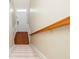 Staircase with carpeted steps and wooden railing, leading to the upper level of the home at 3799 Chattahoochee Summit Se Dr # 5, Atlanta, GA 30339
