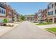 Picturesque street featuring lovely townhomes with attached garages, complemented by well-maintained landscaping at 3799 Chattahoochee Summit Se Dr # 5, Atlanta, GA 30339
