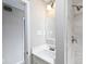 Well-lit bathroom with stylish fixtures, a shower, and white tile surround at 551 Floyd Se Dr, Smyrna, GA 30082