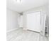 Spacious bedroom with a closet and decorative mirror, along with hardwood floors at 551 Floyd Se Dr, Smyrna, GA 30082