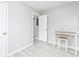 Clean bedroom with light wood flooring, white trim, and white door at 551 Floyd Se Dr, Smyrna, GA 30082