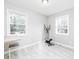 Bright bedroom with hardwood floors, natural light, and a ceiling light at 551 Floyd Se Dr, Smyrna, GA 30082
