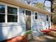 Close-up of a home's front door with flower pot accent at 551 Floyd Se Dr, Smyrna, GA 30082
