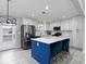Bright kitchen features stainless steel appliances, a large island with seating, and access to the outdoors at 551 Floyd Se Dr, Smyrna, GA 30082