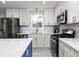 Bright kitchen with stainless steel appliances, and ample counter space at 551 Floyd Se Dr, Smyrna, GA 30082