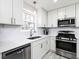 Well-lit kitchen with modern appliances and white countertops at 551 Floyd Se Dr, Smyrna, GA 30082