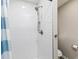 Shower with white tile and a silver shower head, with a toilet in the background at 551 Floyd Se Dr, Smyrna, GA 30082