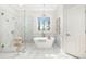Modern bathroom features a soaking tub, glass-enclosed shower, and stylish fixtures at 1967 Mason Mill Rd, Decatur, GA 30033