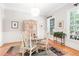 Bright dining room with hardwood floors, stylish table, and views of the outdoors at 1967 Mason Mill Rd, Decatur, GA 30033