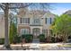 Charming two-story home featuring a stone facade, manicured landscaping, and classic architectural details at 1967 Mason Mill Rd, Decatur, GA 30033