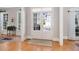 Bright foyer showcasing hardwood floors, white trim, and French doors leading to the backyard at 1967 Mason Mill Rd, Decatur, GA 30033