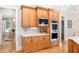 Well-equipped kitchen featuring wooden cabinets, modern appliances, and bright countertops at 1967 Mason Mill Rd, Decatur, GA 30033